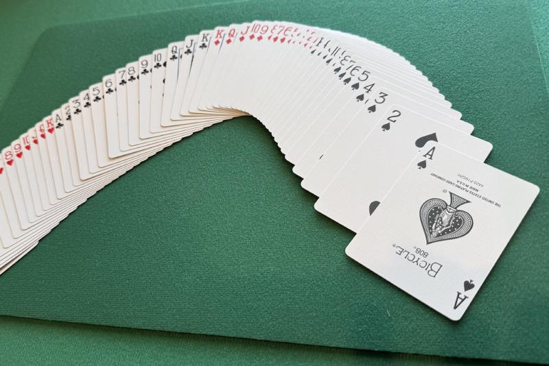 A deck of playing cards spread face up in US New Deck Order